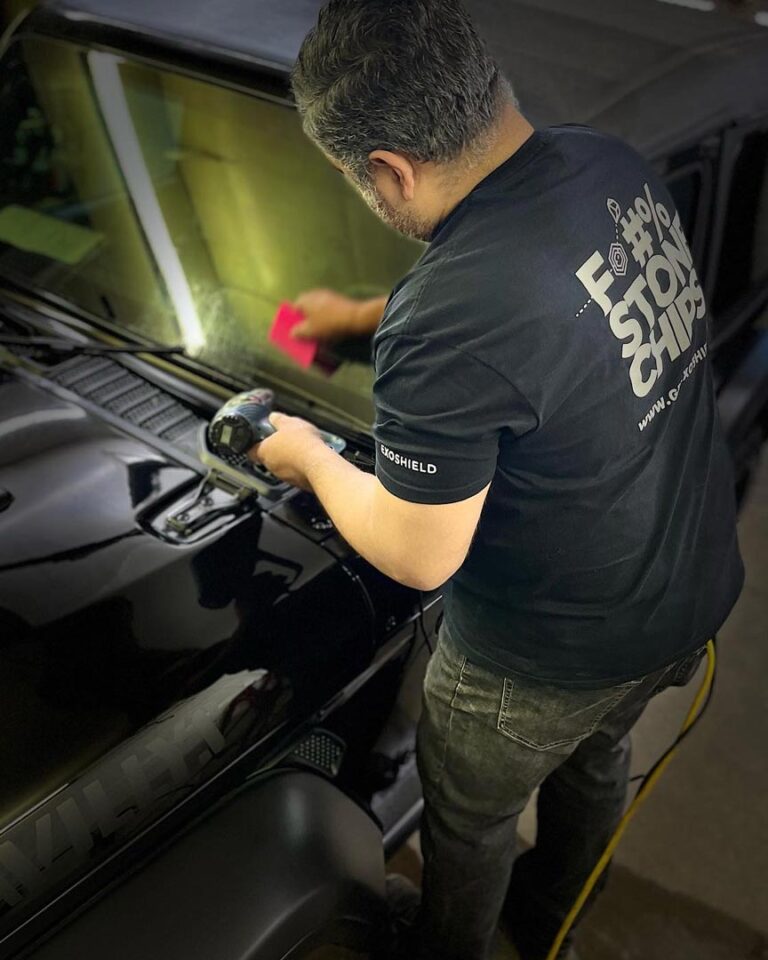 man-working-on-cleaning-car